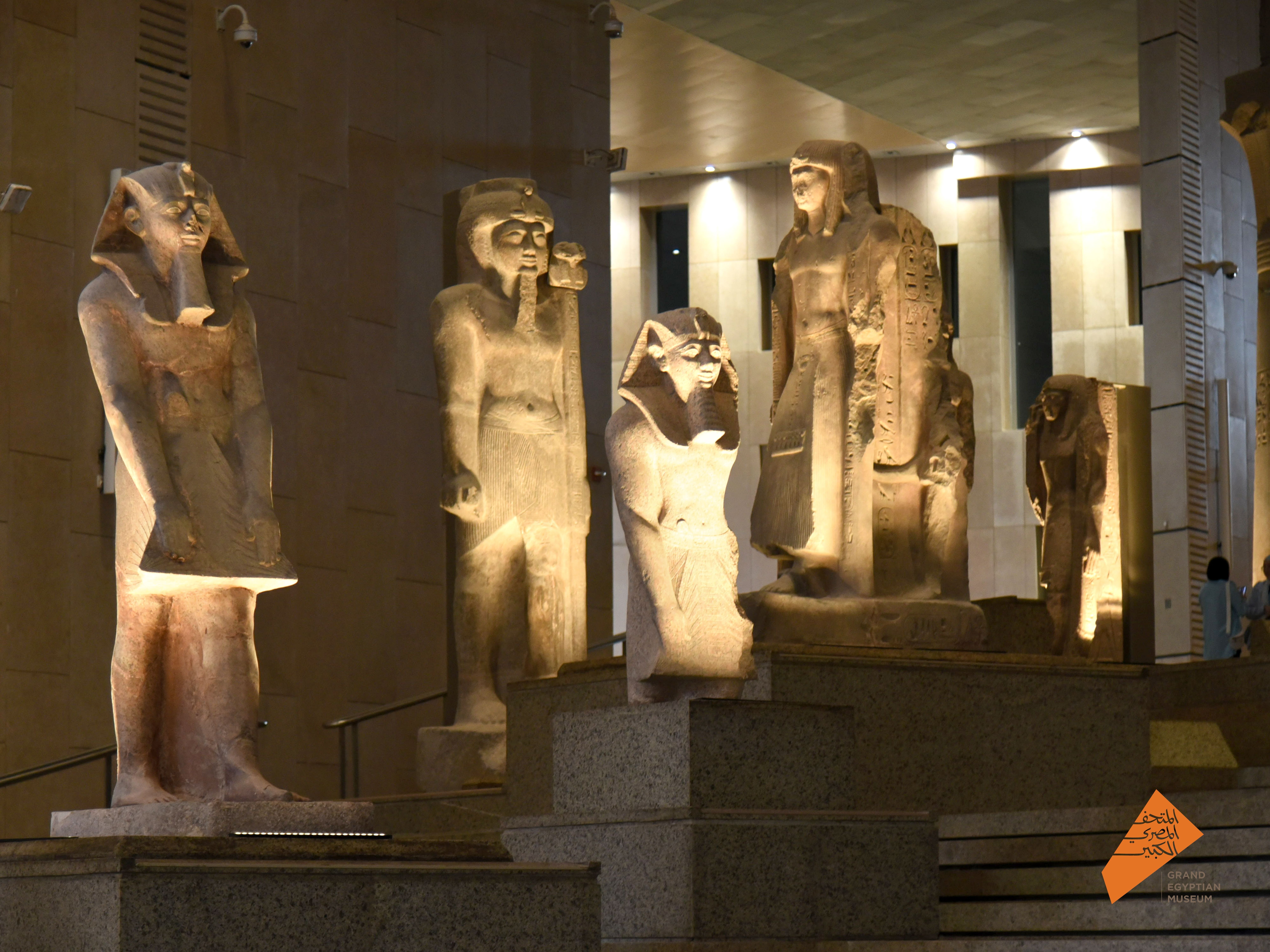 Ancient Egyptian statues in a museum gallery