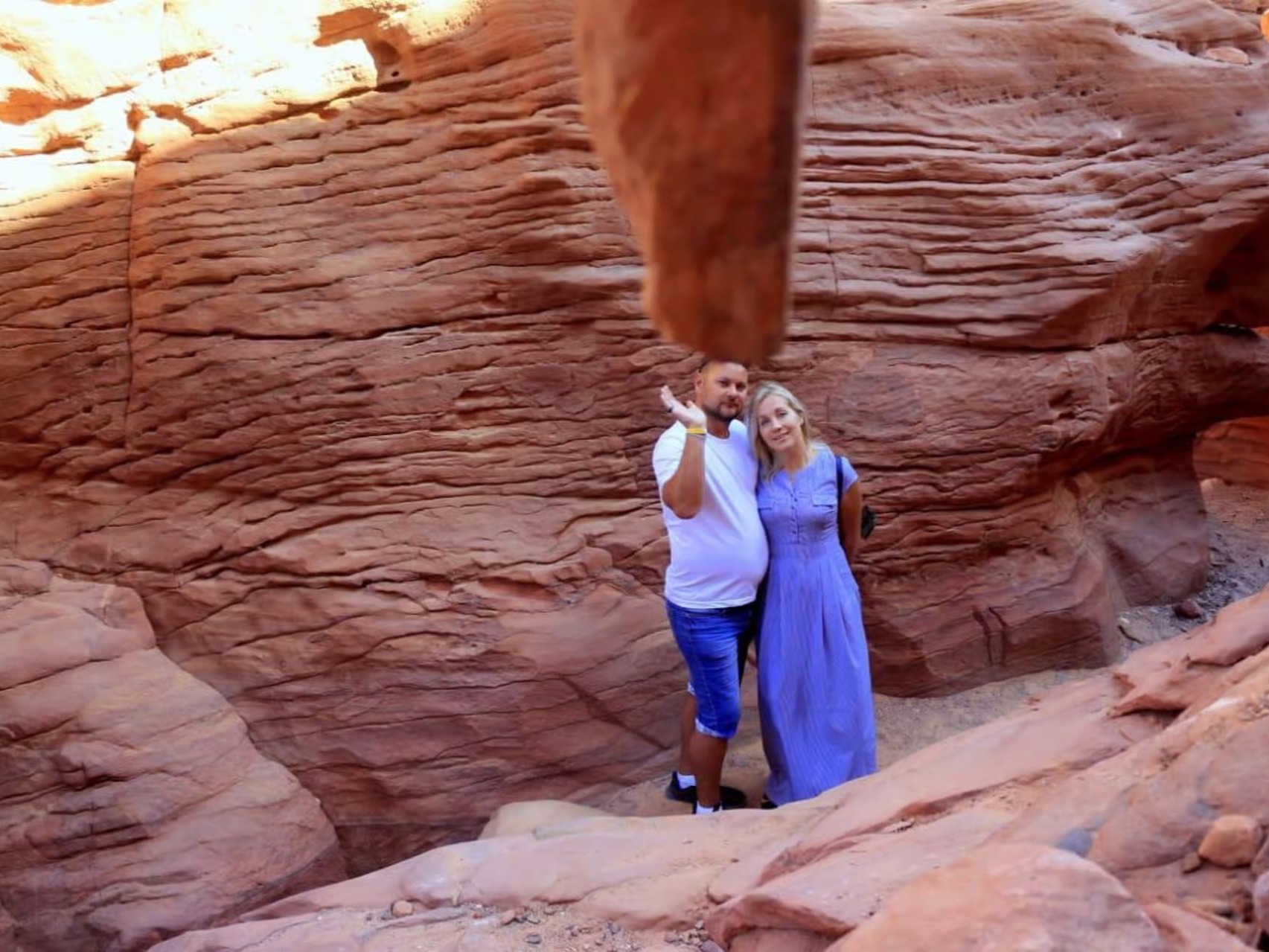 Guests exploring a red sandstone canyon