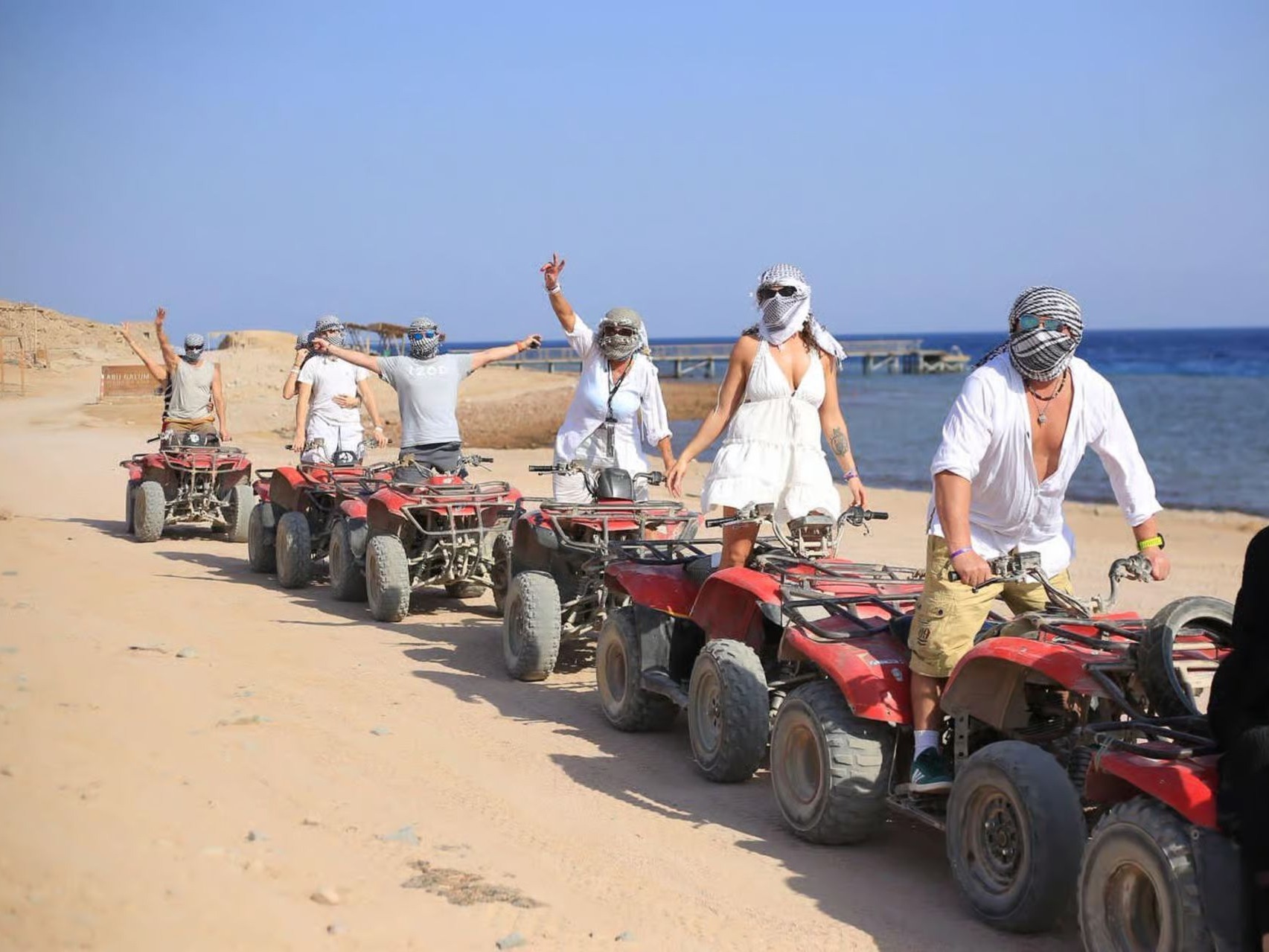 Quad bikes lined up in the desert