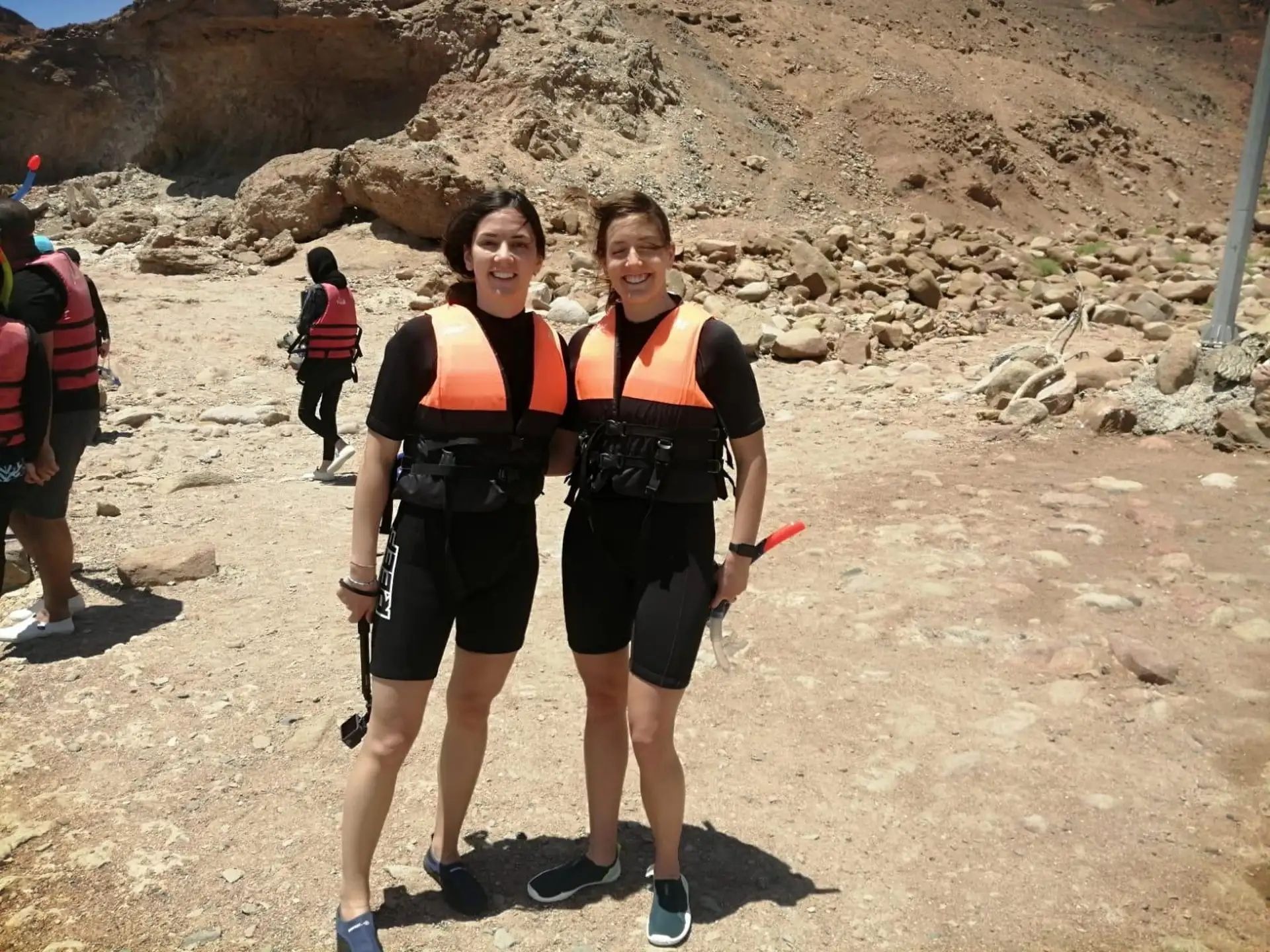 Guests in snorkelling gear on a mountain trail