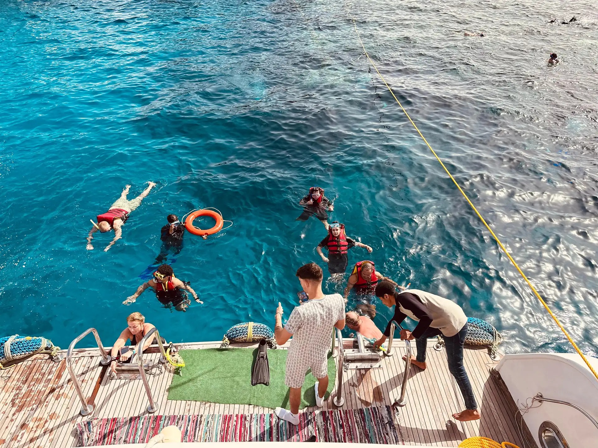 Guests entering the Red Sea from the boat